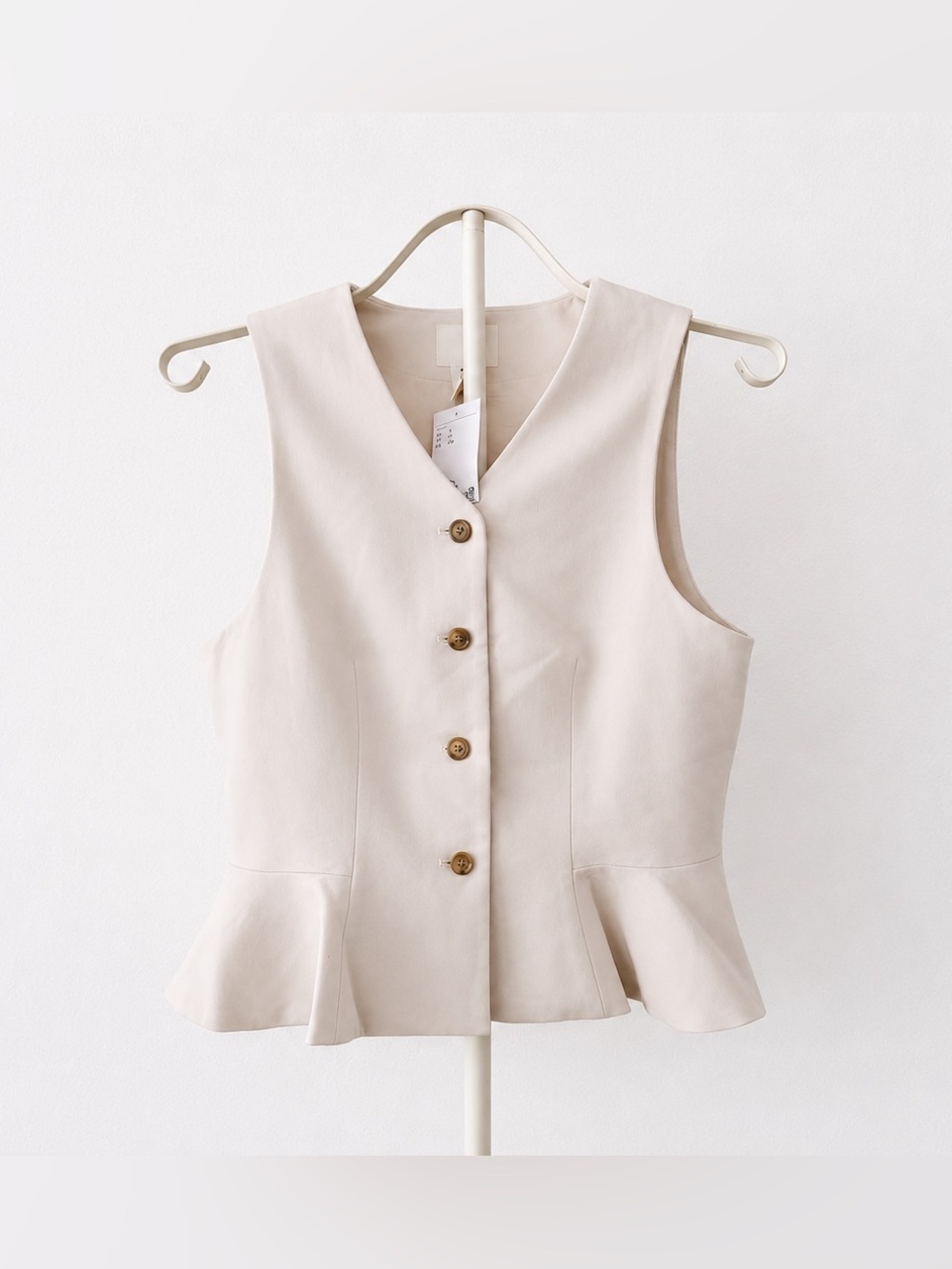 Sleeveless Peplum Button-Front Top in cream